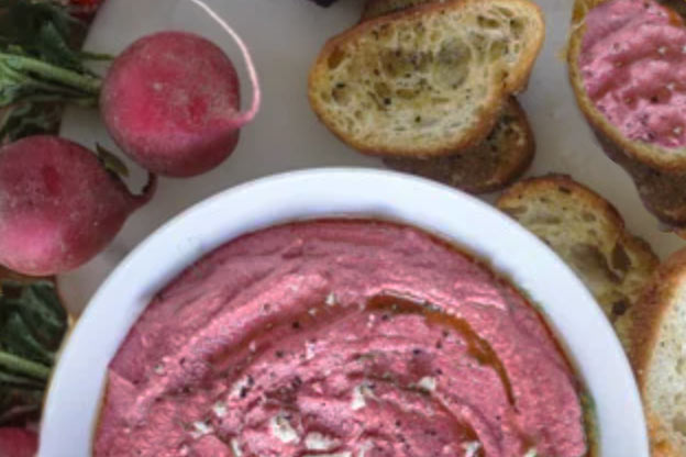 beet cheese spread on slices of baguette